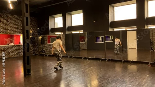 Gay male choreographer dances with fan