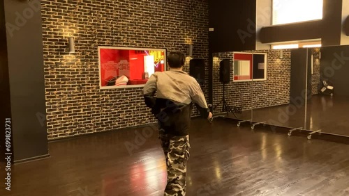 Gay male dancer struts his stuff in dance studio