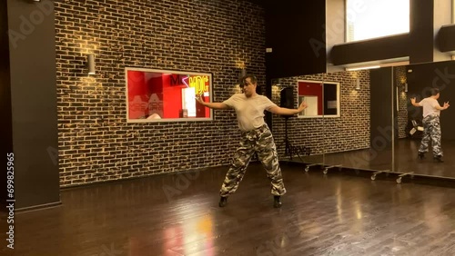 Gay male dancer performs contemporary lyrical dance routine in heels