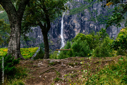 A swing in a beautiful landscape with waterfalls. 