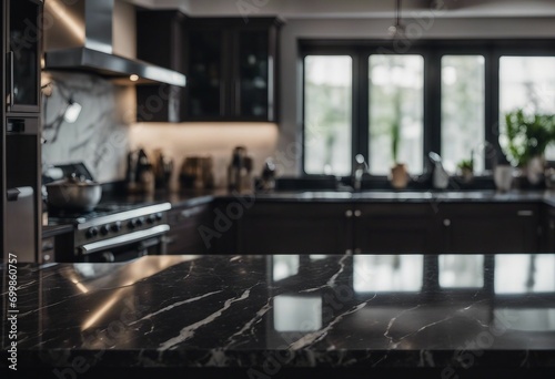 Modern empty dark marble table top or kitchen island on blurry bokeh kitchen room interior background © ArtisticLens