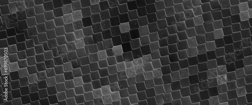 Abstract textured background with symmetrical scales in different shades of black