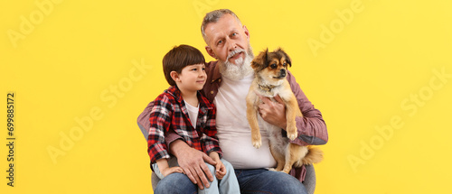 Cute little boy with grandf...