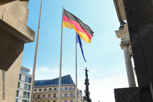 Germany and European Union flags near Reichstag building in Berlin