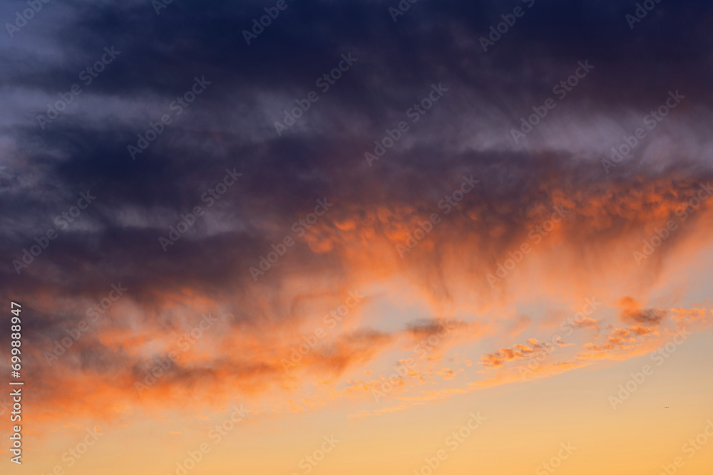 Colorful sunset with clouds in the evening, Fantastic view of the dark overcast sky. Dramatic and picturesque morning scene, Panorama of a textured purple sky at sunset