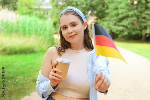 Young woman with flag of Ge...
