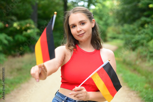 Young woman with flags of G...