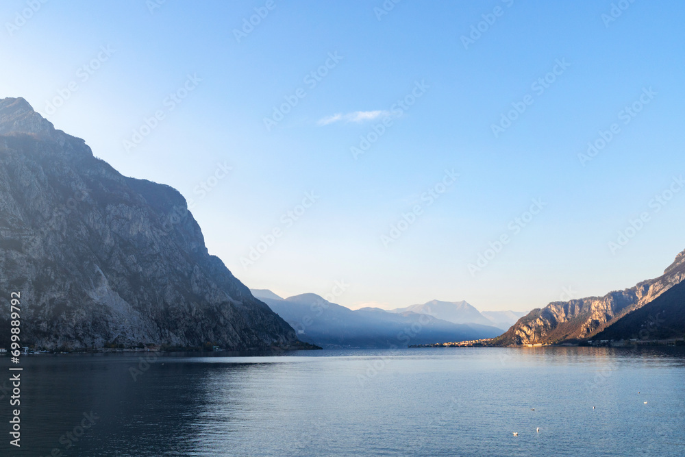 Mountain landscape, picturesque mountain lake in the summer morning, large panorama, landscape with fabulous lake view from the top of the mountain, with view of city. Como, Italy