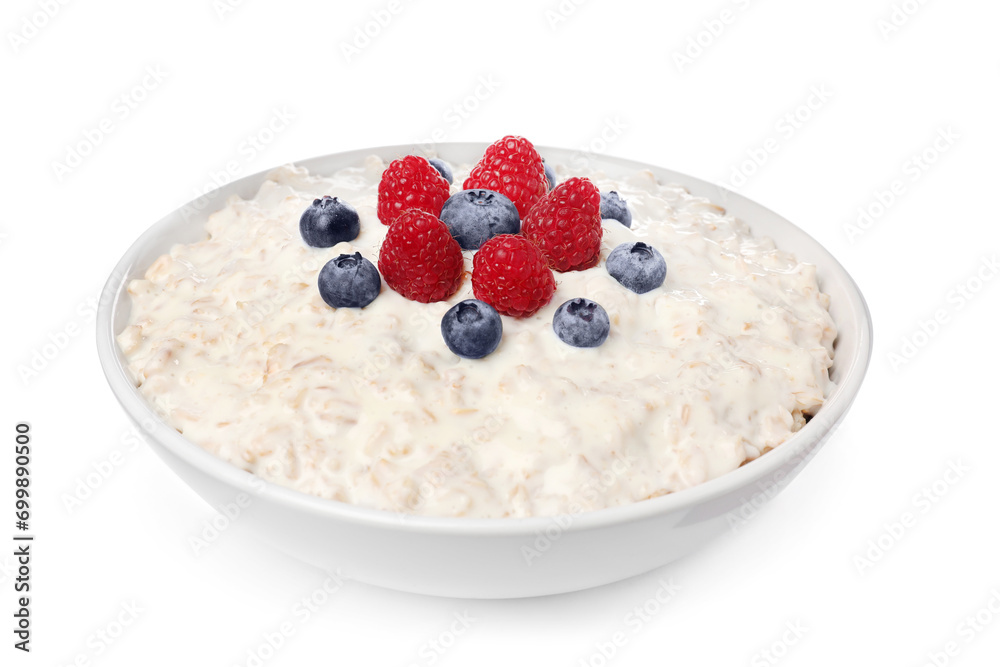 Tasty boiled oatmeal with berries in bowl isolated on white Tasty boiled oatmeal with berries in bowl isolated on white