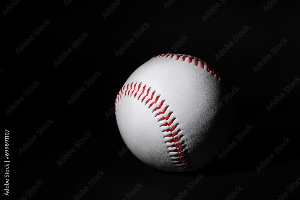 One leather baseball ball on black background One leather baseball ball on black background