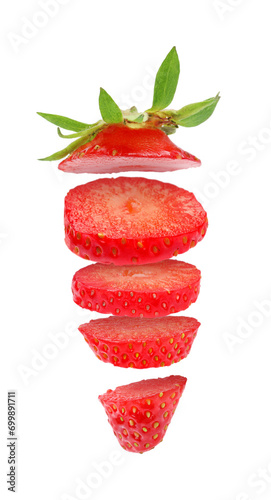 Slices of fresh ripe strawberry falling on white background