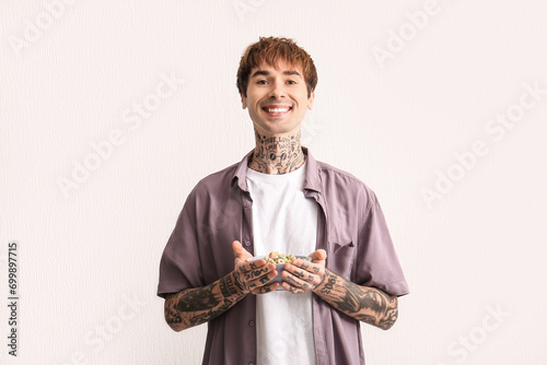 Man holding bowl with cerea...