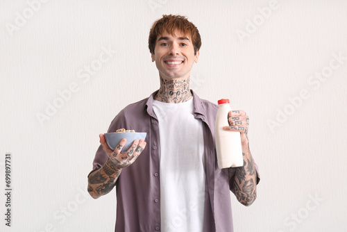Man holding bowl with cerea...