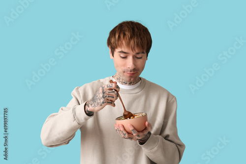 Man holding bowl with cerea...
