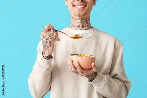 Man holding bowl with cerea...