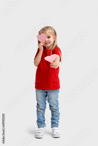 Happy little girl holding p...