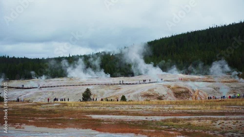 People walking by Upper Geyser Basin - Yellowstone photo