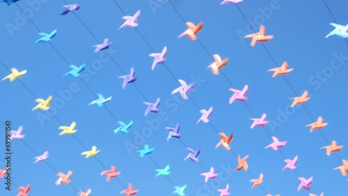 Decoration of the venue with small windmills of various colors during the New Year festival.
