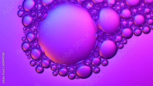 Top view pink soap bubbles floating on the water, color light background