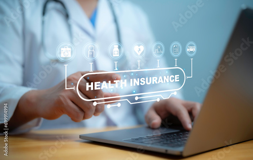 .A medical worker using virtual with health care icons, medical technology background, health insurance business.Health Insurance, telemedicine, virtual hospital, family medicine concept.