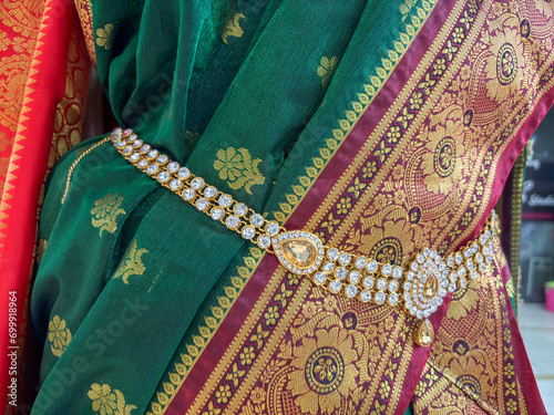 ​A woman wearing traditional sari with belly chain jewellery known as kamarband or kamarpatta