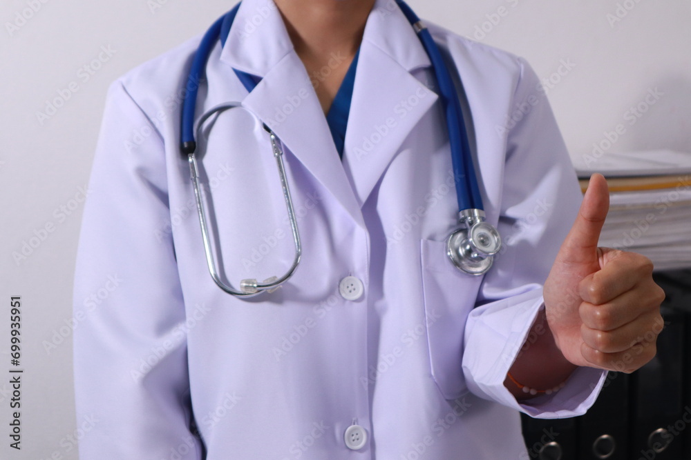 Close up of the ears of a professional female doctor in uniform taking notes in a notebook Medical therapist filling out medical documents. Clipboard. Patient form. Illness history, prescription Close up of the ears of a professional female doctor in uniform taking notes in a notebook Medical therapist filling out medical documents. Clipboard. Patient form. Illness history, prescription