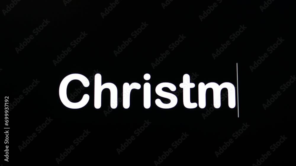 Text written on black screen with the word Christmas in white Text written on black screen with the word Christmas in white