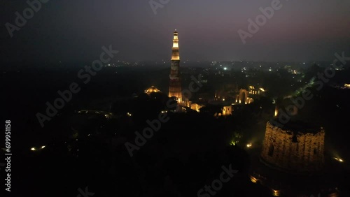 A Night Aerial shot of Qutub Minar at New Delhi in India
