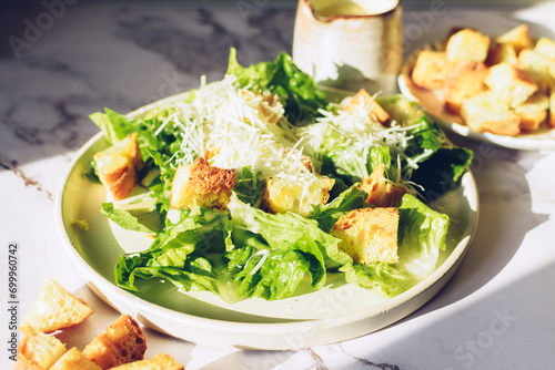 Classic caesar salad with lettuce, croutons and parmesan cheese