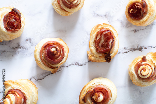 Puff pastry swirls. Close-up of puff pastry with prosciutto. 