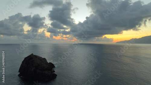 Footage filmed in Madeira Portugal at Ilheus da Ribeira da Janela sea stacks. Filmed at sunrise with incredible landscapes, ocean, cliffs and nature all around. Filmed with a drone in 4k photo