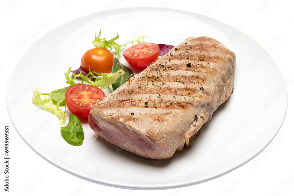 grilled cooked piece of tuna fillet on ceramic plate isolated