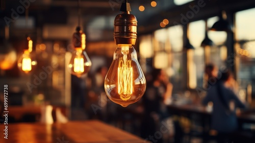 Warm filament bulb hangs in a modern cafe's ambiance.