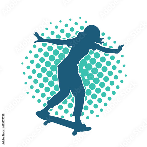 Silhouette of a female in action pose on skateboard. Silhouette of an urban girl on skateboard.
