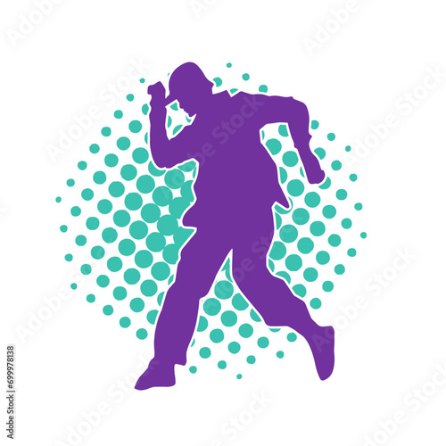 Silhouette of a male dancer in performing pose. Silhouette of a dancing man.