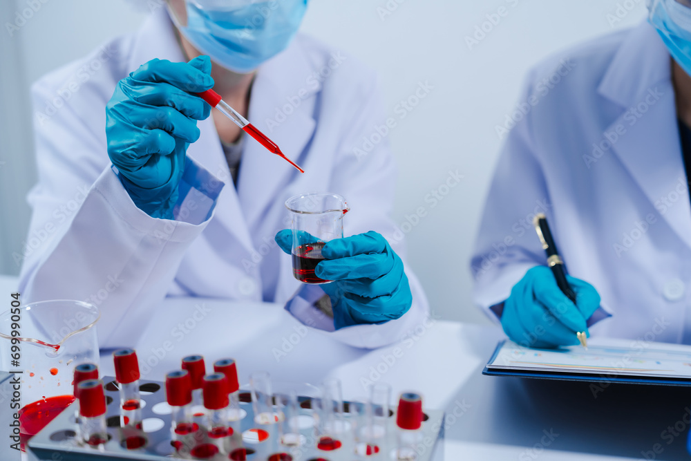Professional scientists in lab working with blood samples. to find components in blood Ideas for inventing and researching drugs and viruses in blood system. Professional scientists in lab working with blood samples. to find components in blood Ideas for inventing and researching drugs and viruses in blood system.