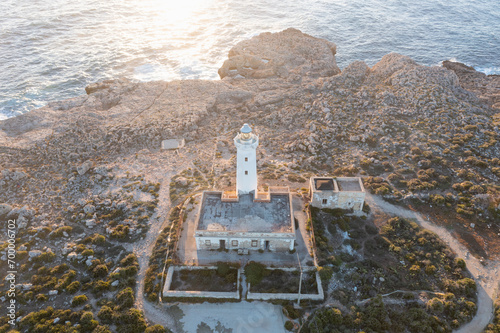 Summer Capo Murro di Porco old abandoned lighthouse - Syracuse, Sicily, Italy, Mediterranean sea.
A beautiful sunny day by the seashore. An active holiday. photo