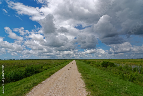 A small Gravel Road or Trail passing through the San Bernard National Wildlife Refuge near to Freeport in Texas.