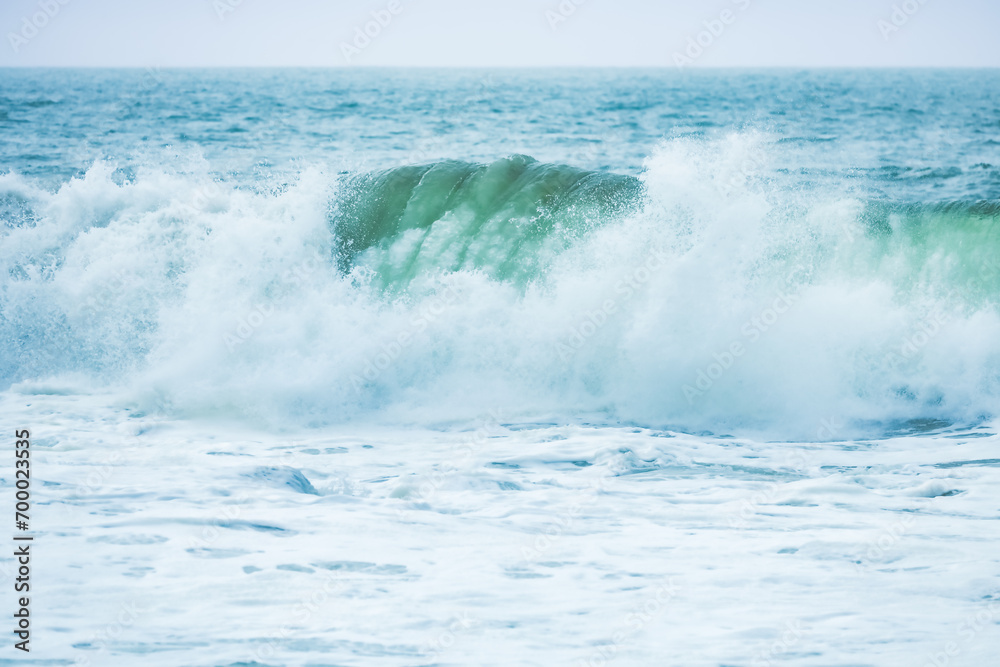 Wave splashing close-up. Crystal clear sea water, in the ocean in San Francisco Bay, blue water, pastel colors.