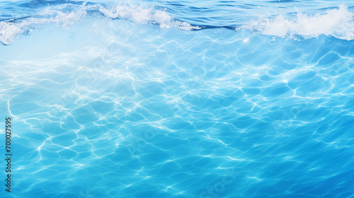 Clear blue water surface with splashing ripples.