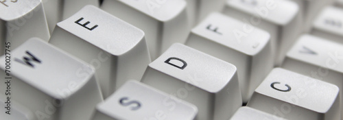 Closeup of typing keyboard with E D C alphabet focused. photo