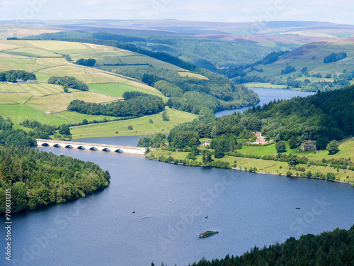 High angle view of arched bridge viaduct over Ladybower Reservoir in Peak District National Park in United Kingdom on a beautiful summer day.