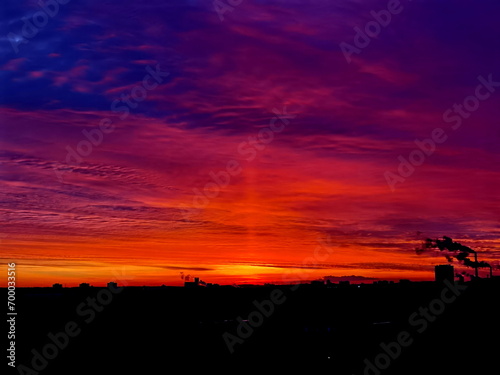 Minsk, Belarus, December 28, 2023. Spectacular sunrise. A light pillar is an atmospheric optical phenomenon in which a vertical beam of light appears to extend above andor below a light source.
