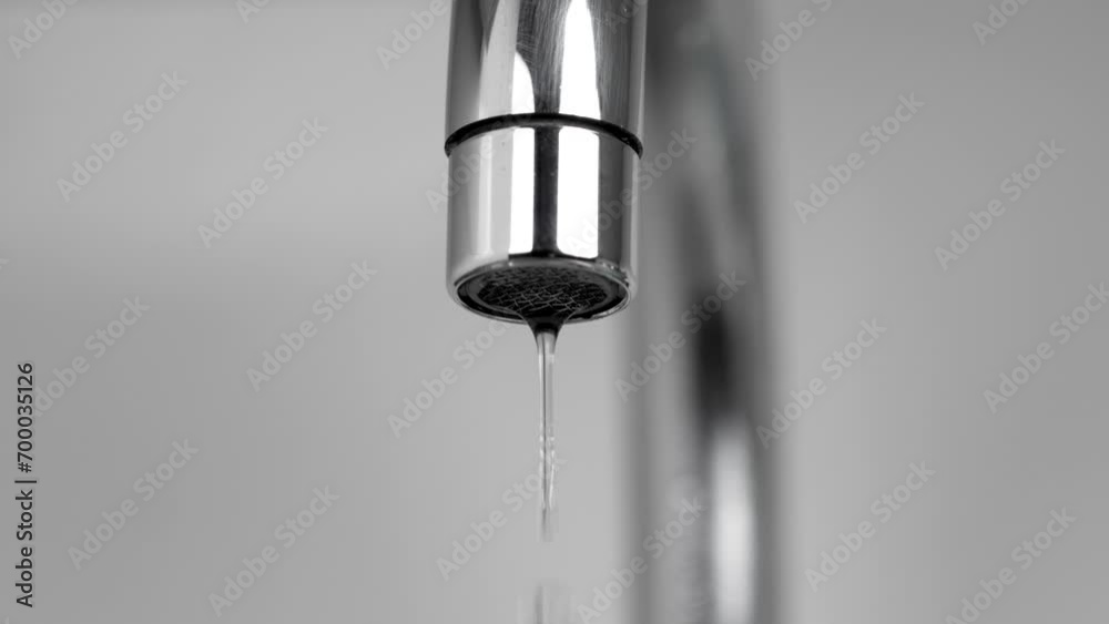 Dripping water faucet or kitchen tap. Shortage and conservation of natural resources concept