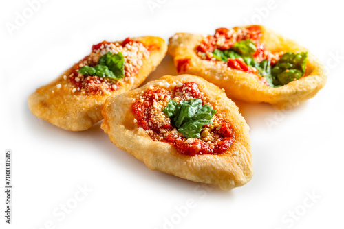 Deliziose pizzette fritte campane condite con pomodoro, mozzarella e basilico, cibo italiano  photo