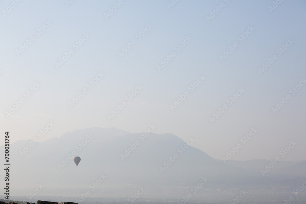 Lone balloon flying over the mountains of Turkey's hinterland