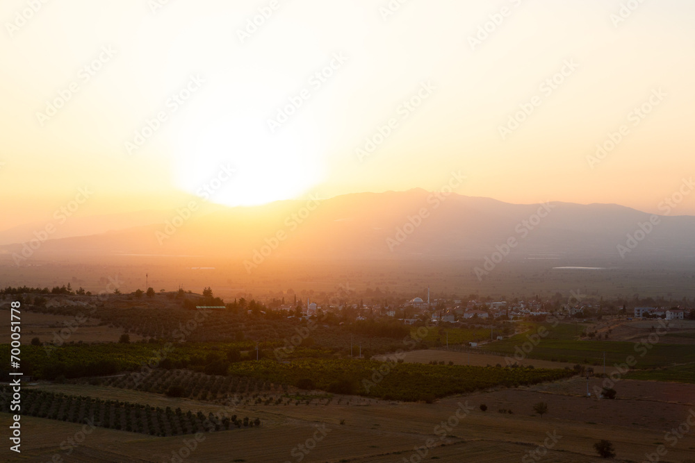 Sunset in the Turkish hinterland with village in the background
