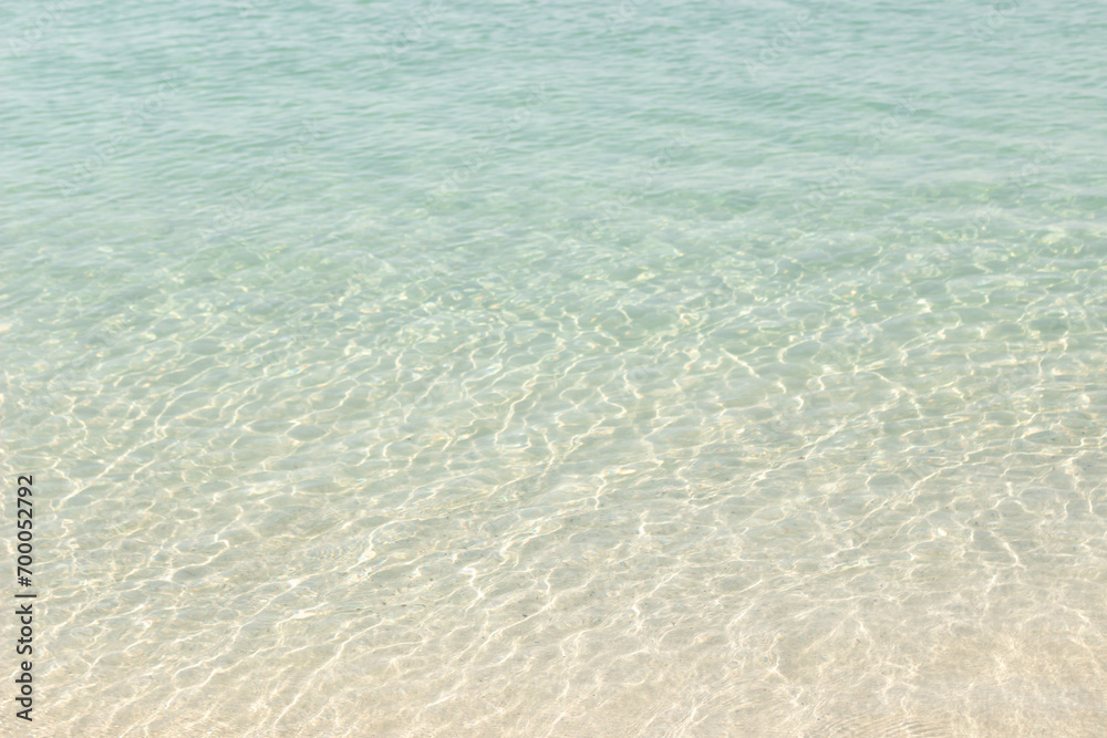 Naklejka premium Abstract texture of water on sand beach