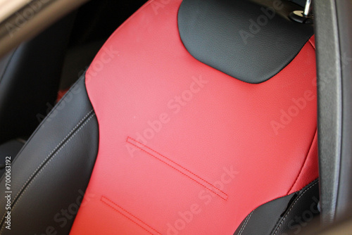 Close up of a red and black car seat