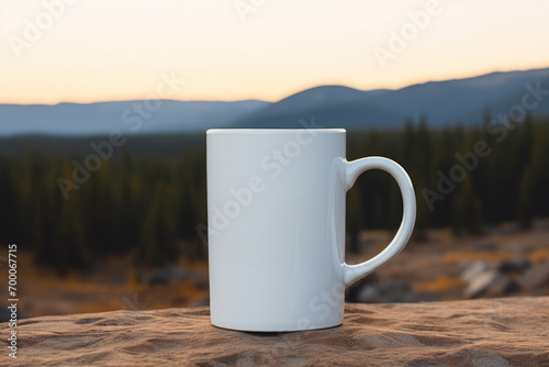 White cup mockup with hot chocolate or coffee on mountain panorama background
